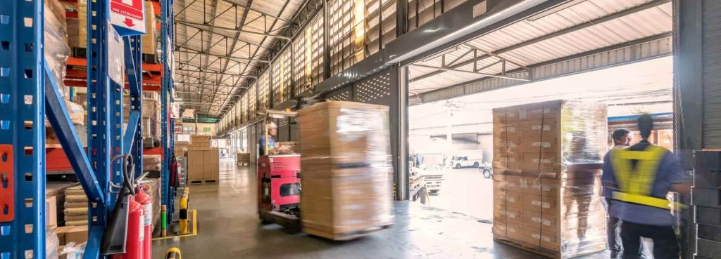 Industrial distribution center with pallets and storage aisles