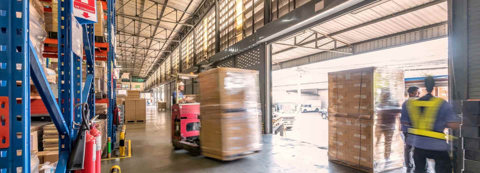 Industrial distribution center with pallets and storage aisles