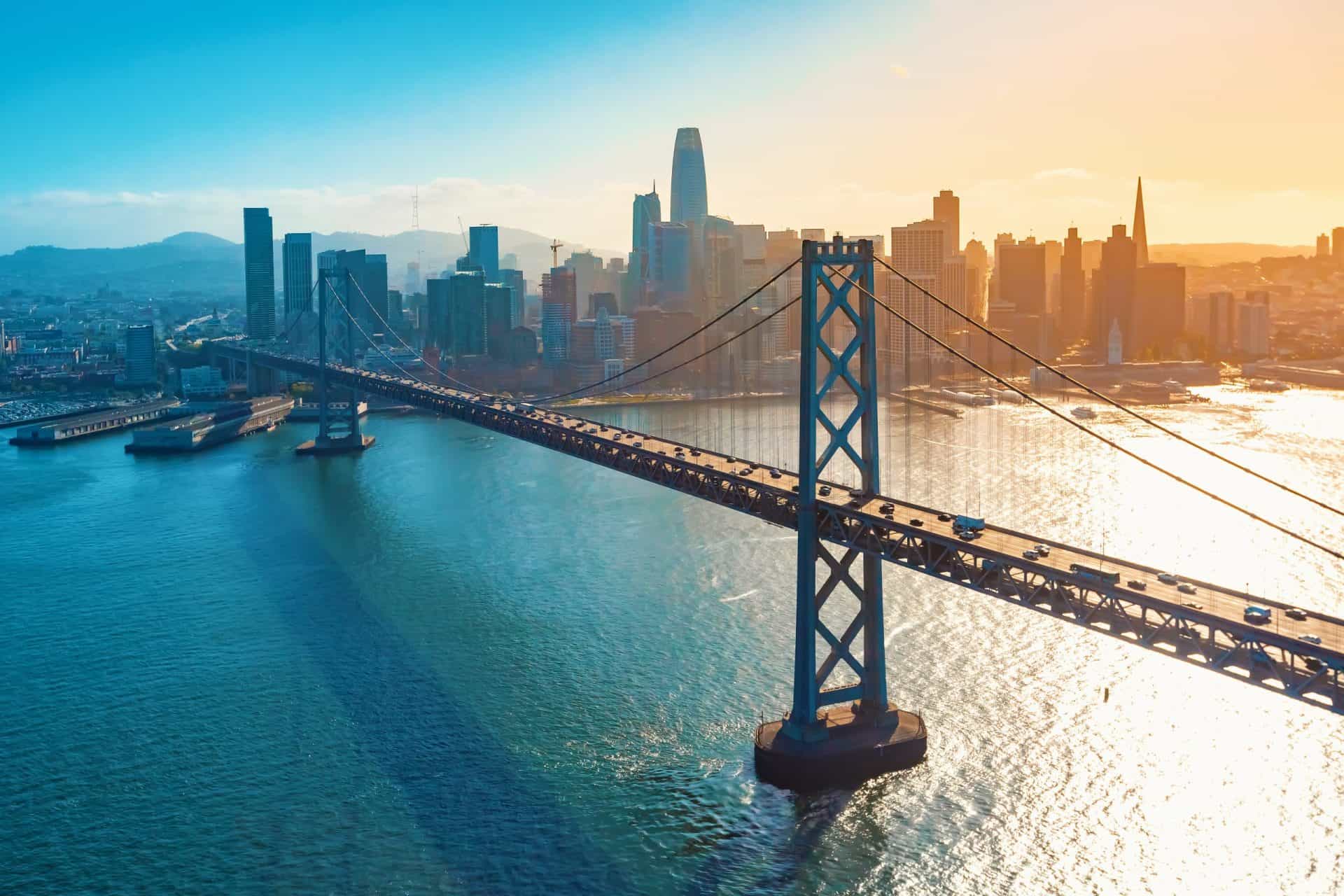 Aerial view of bridge and coastal city skyline