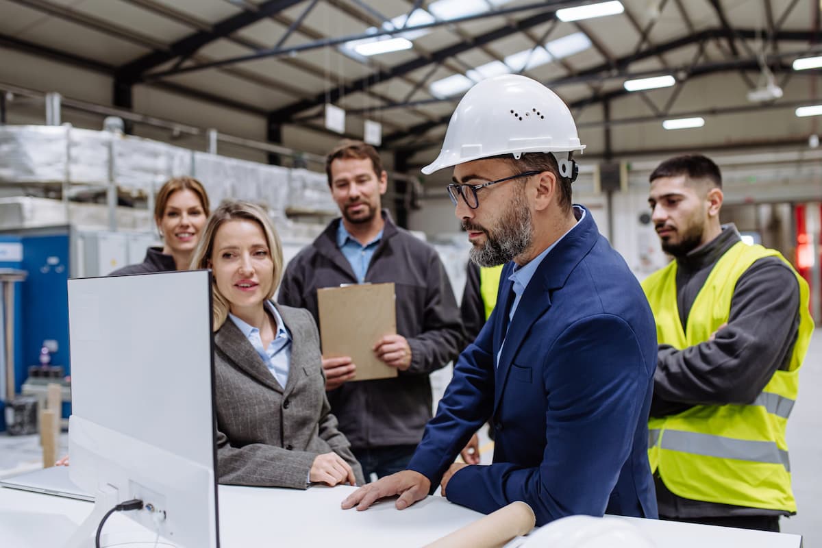 Construction project team reviewing building plans on site