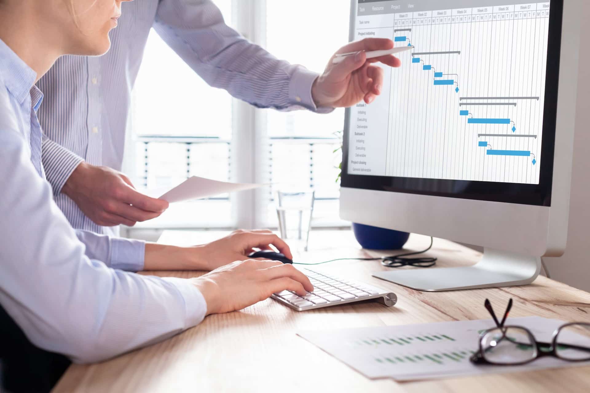 Business professional analyzing data on a computer screen